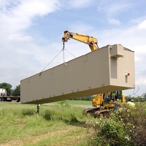 Photo of crane moving AdvanTex AX-Max unit used to remediate failing septic systems