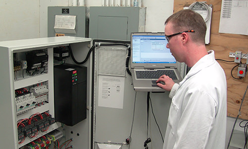 Photo of IT staff testing equipment